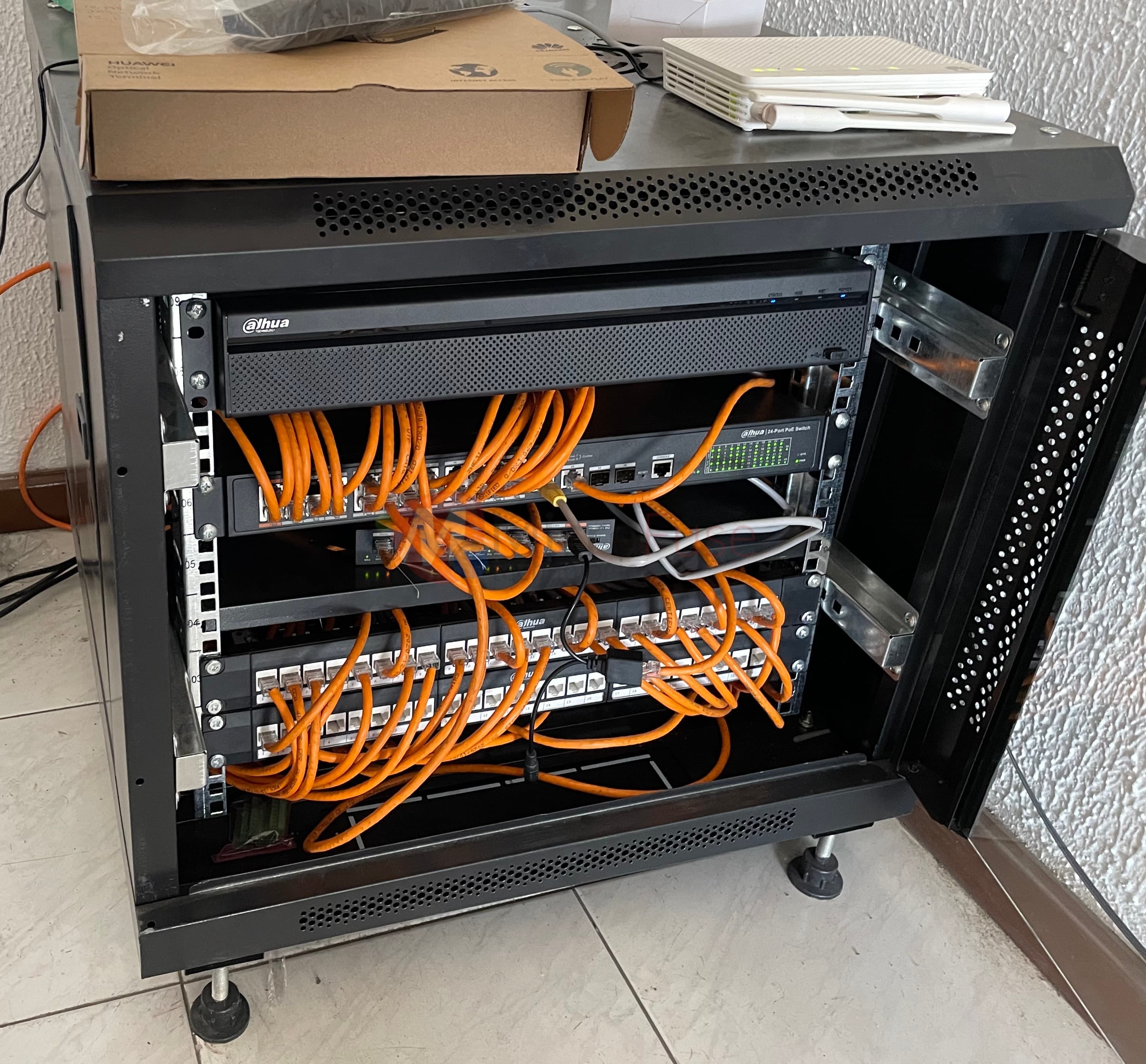 Network rack with PoE switches and patch panels